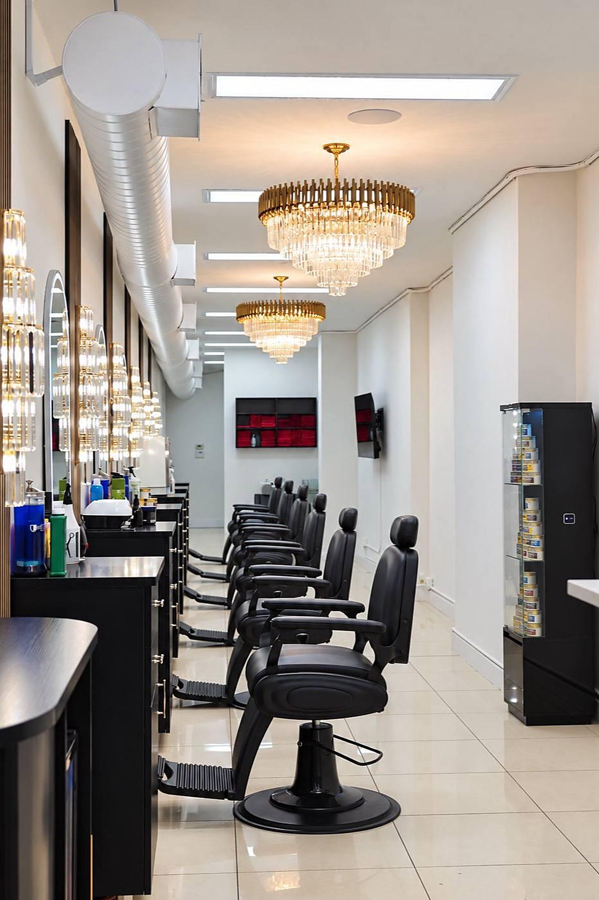 Inside the shop — barber chairs and chandeliers
